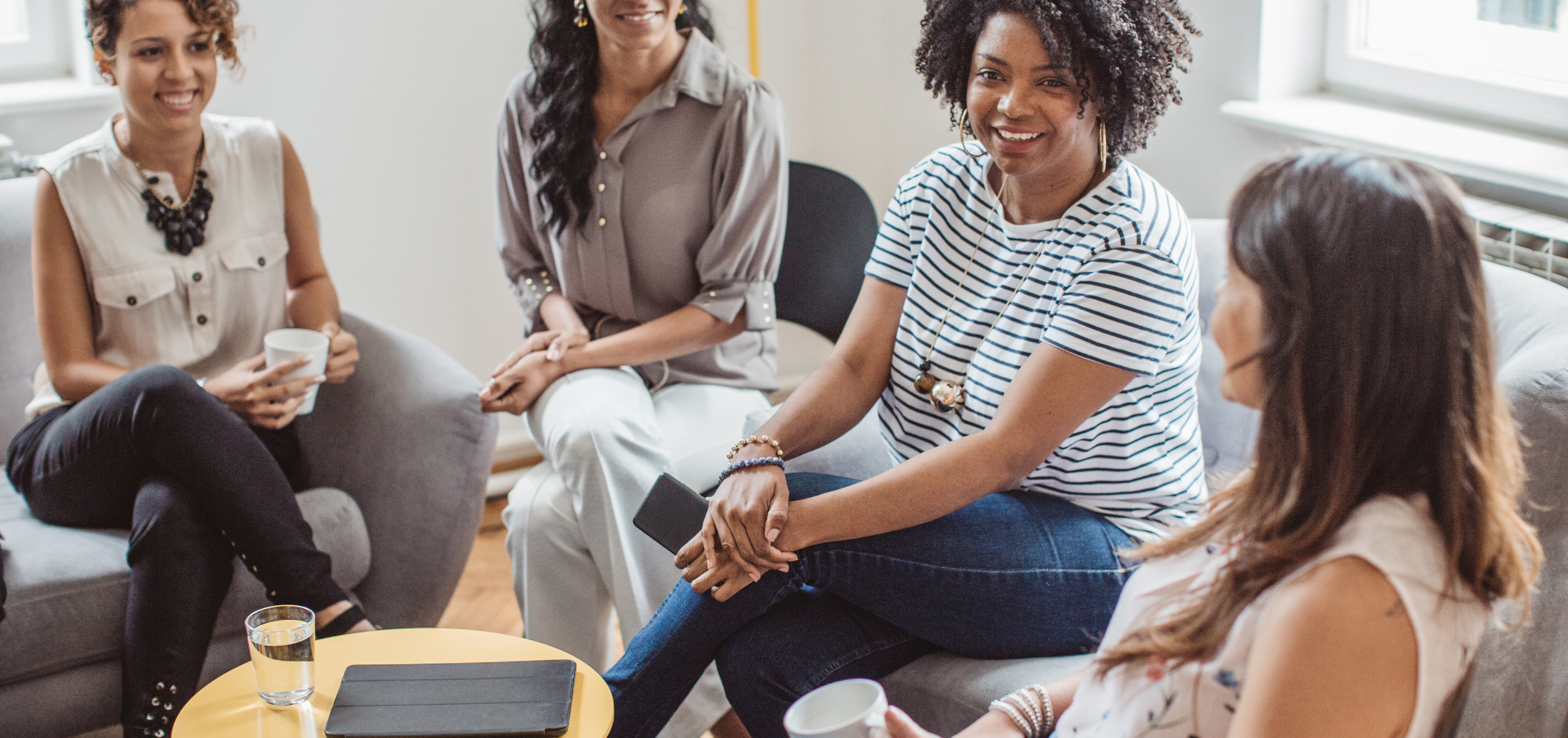 Group of women sitting in a circle talking